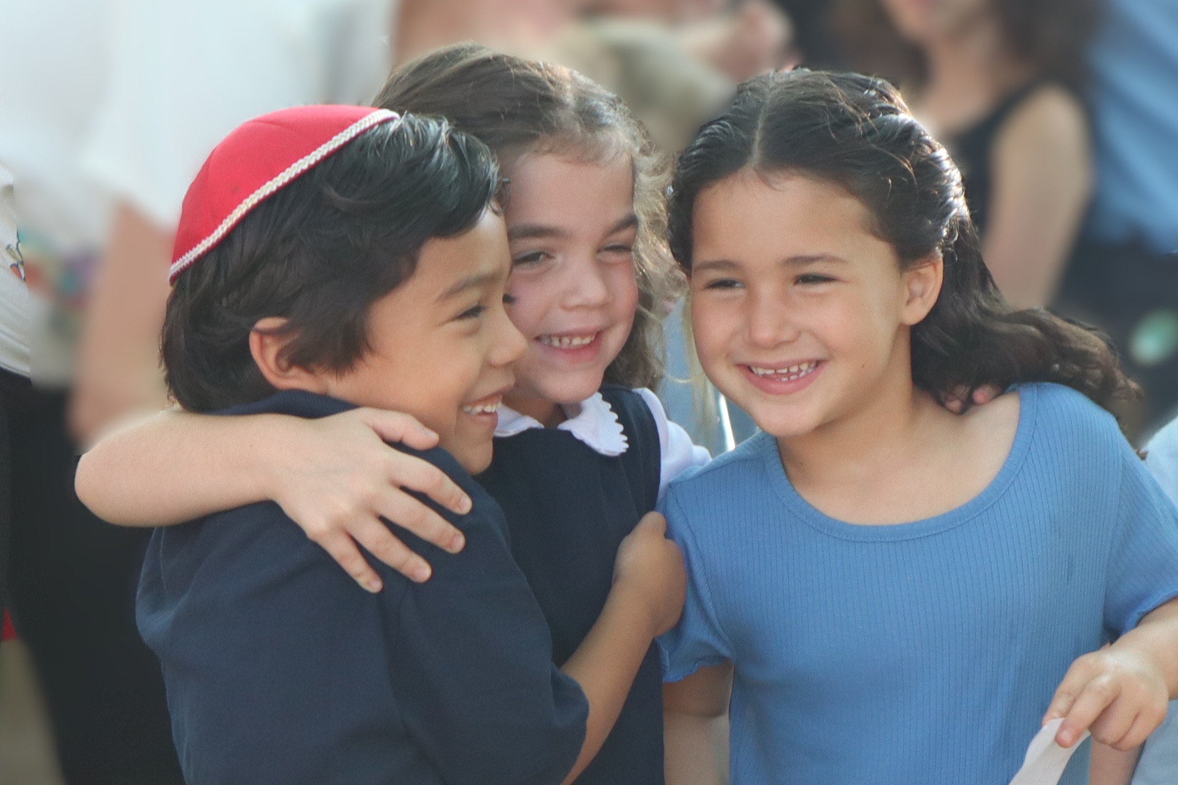 children smiling and hugging